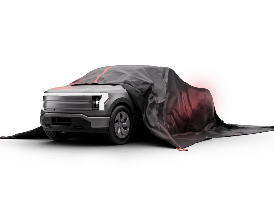 Bridgehill Car Pro X fire blanket covering electric car fire in garage